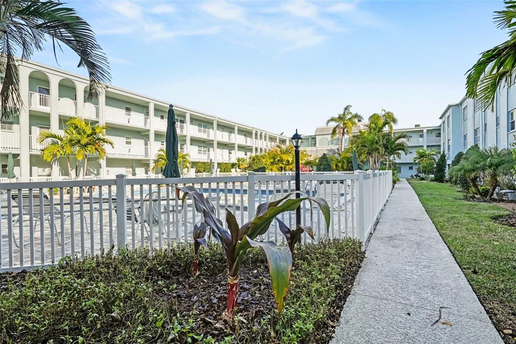 701 Poinsettia Road, Unit 240 Belleair, FL 33756 - Photo 25 of 30 a garden view with a seating space