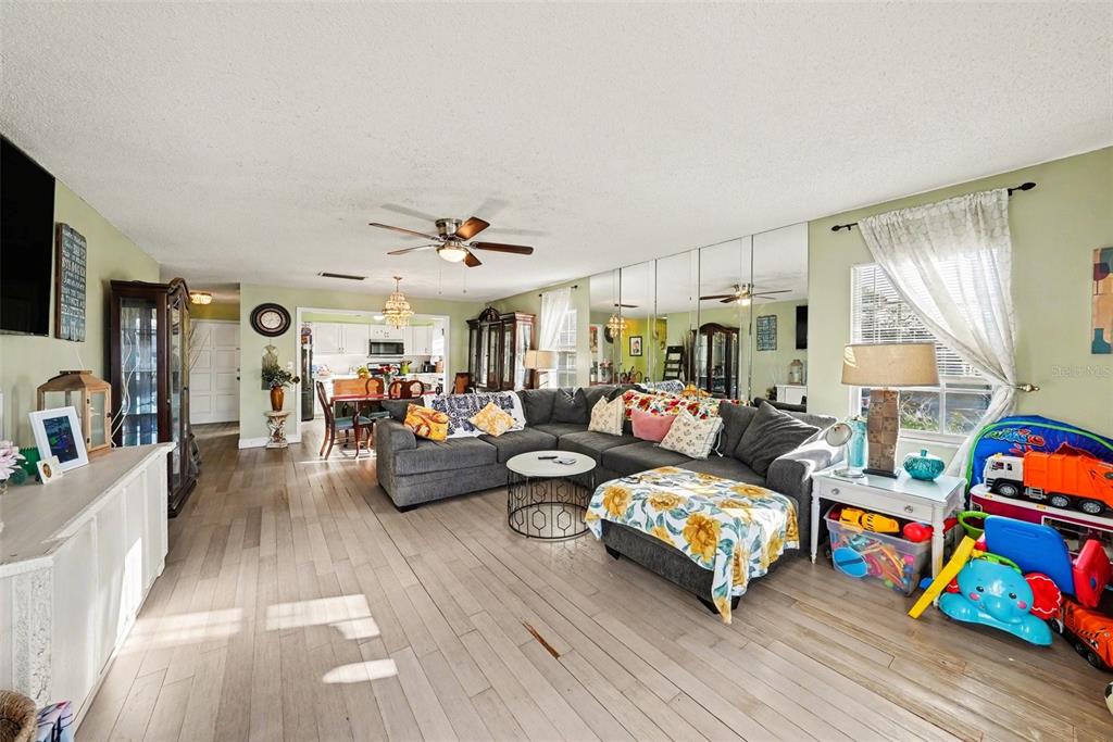 701 Poinsettia Road, Unit 240 Belleair, FL 33756 - Photo 5 of 30 a bedroom with furniture and a wooden floor