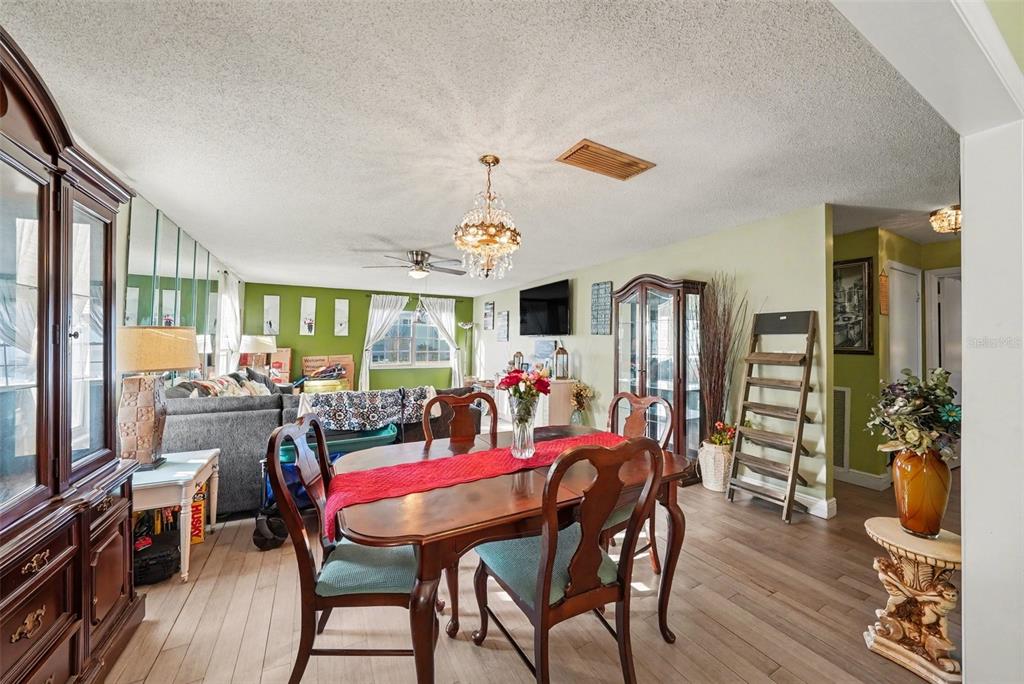 701 Poinsettia Road, Unit 240 Belleair, FL 33756 - Photo 7 of 30 a view of a dining room with furniture window and wooden floor