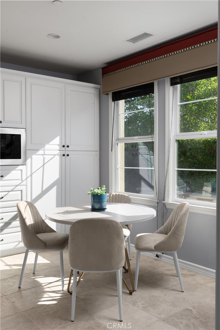 7 Waltham Road Ladera Ranch, CA 92694 - Photo 18 of 55 a view of a dining room with furniture window and outside view
