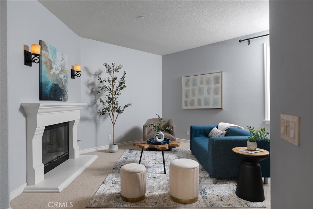 7 Waltham Road Ladera Ranch, CA 92694 - Photo 21 of 55 a living room with furniture a fireplace and potted plants