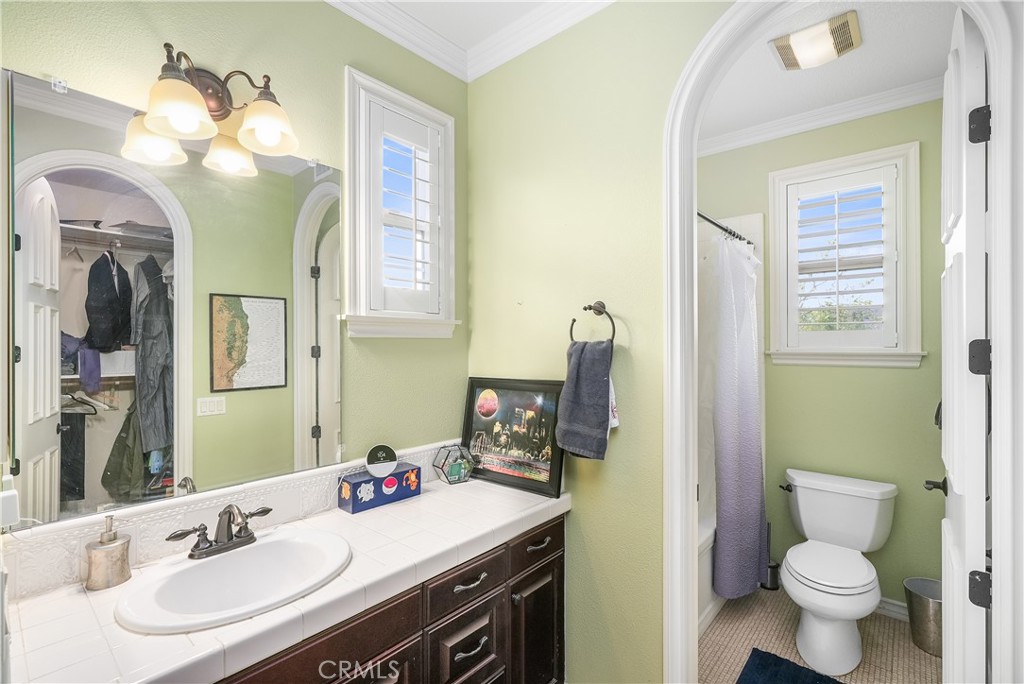 7 Waltham Road Ladera Ranch, CA 92694 - Photo 26 of 55 a bathroom with a toilet sink and mirror