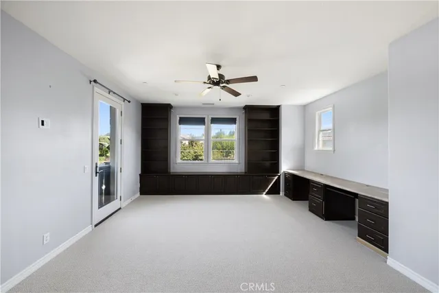 a view of a big room with windows and cabinet