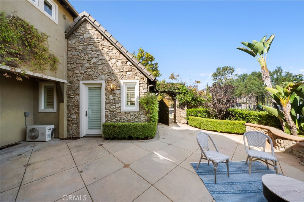 7 Waltham Road Ladera Ranch, CA 92694 - Photo 5 of 55 a view of a chair and table in the patio with potted plants