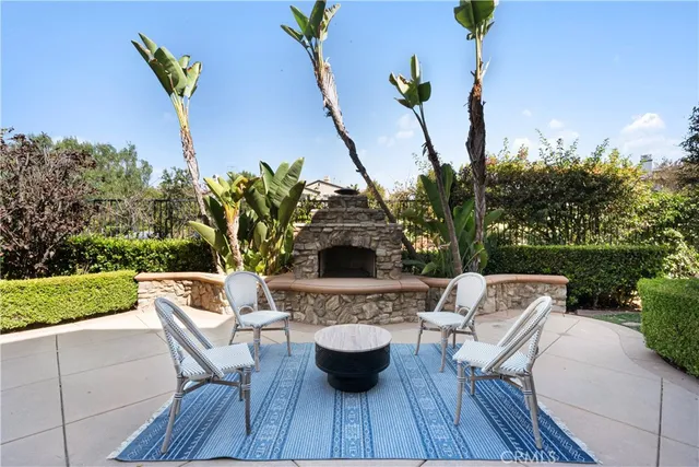 a living room with furniture a fireplace and a window