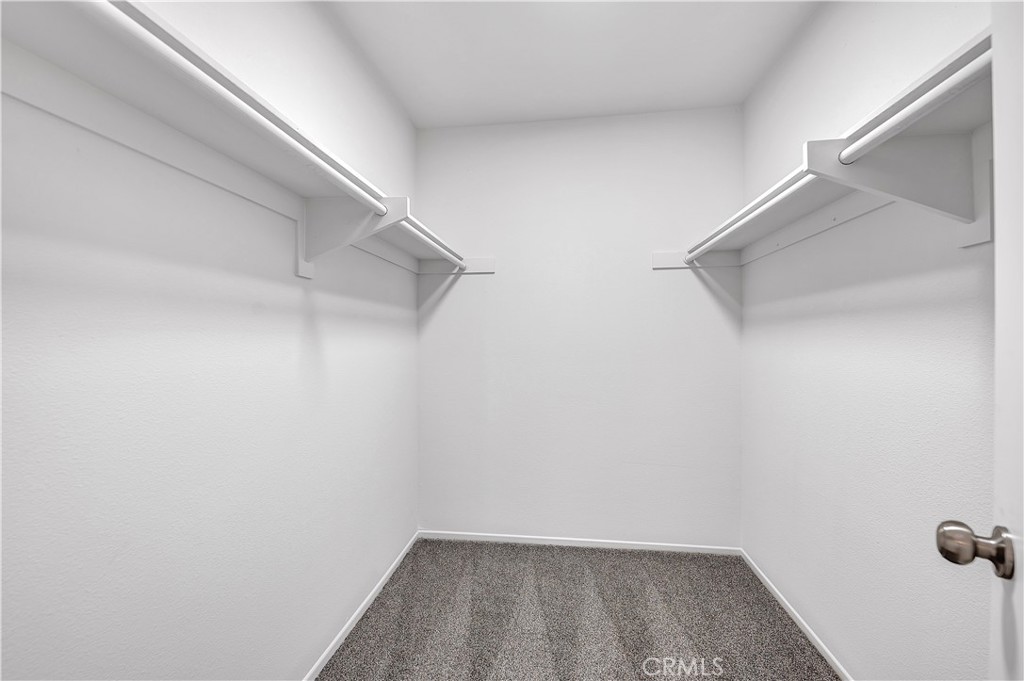 27042 Rangewood Street Menifee, CA 92586 - Photo 17 of 22 a view of small space with racks on the wall