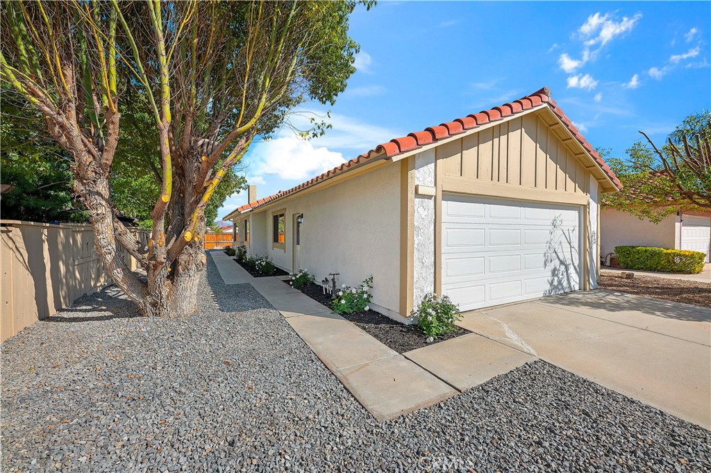 27042 Rangewood Street Menifee, CA 92586 - Photo 2 of 22 a view of a house with a yard