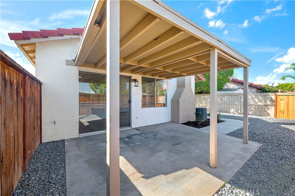 27042 Rangewood Street Menifee, CA 92586 - Photo 21 of 22 a view of a house with a backyard