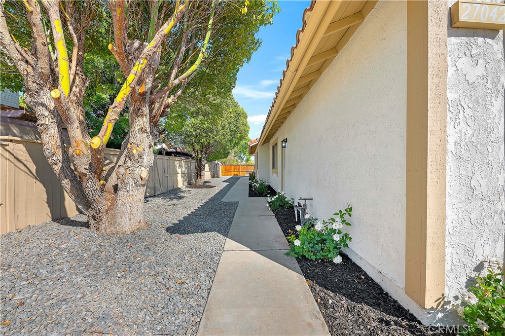 27042 Rangewood Street Menifee, CA 92586 - Photo 6 of 22 a view of a backyard with pathway