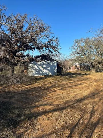 a view of street with view of house