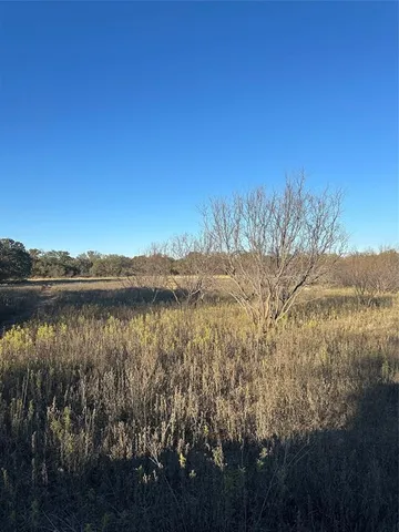 a view of lake with green space