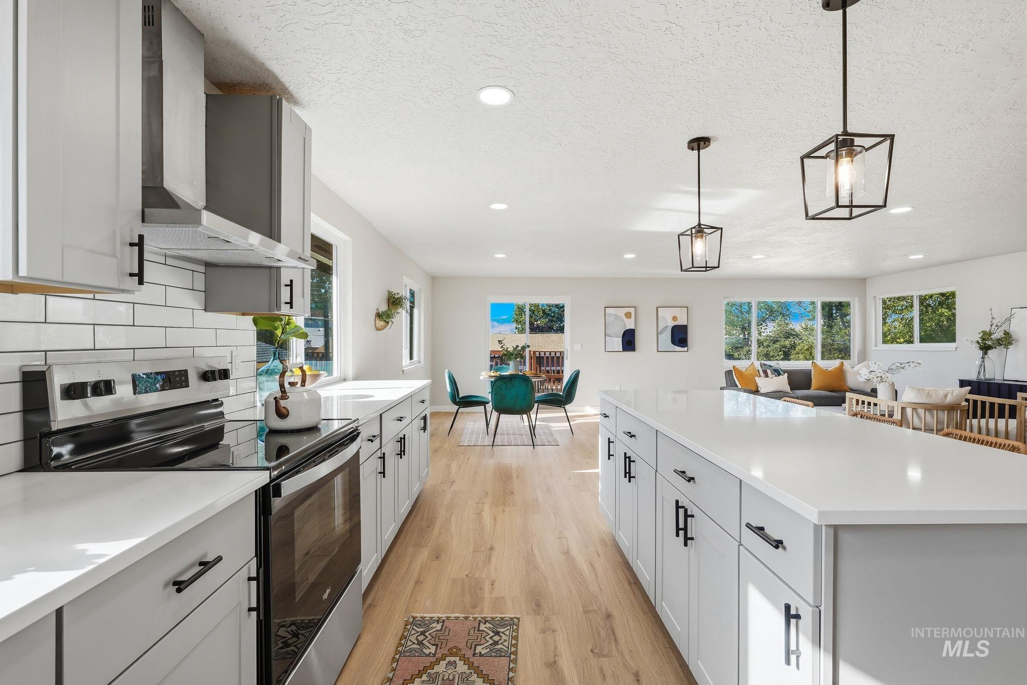 1990 Panama Street Boise, ID 83705 - Photo 26 of 50 Modern kitchen featuring an electric range, stainless steel appliances, and light gray cabinetry