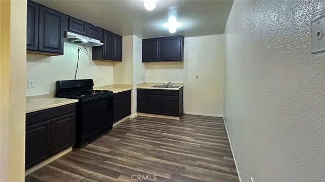 a view of hallway with wooden floor
