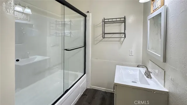 a bathroom with a sink and mirror