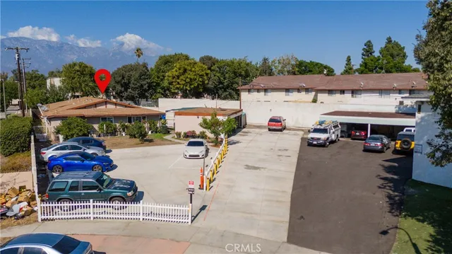 an outdoor space with patio furniture and potted plants