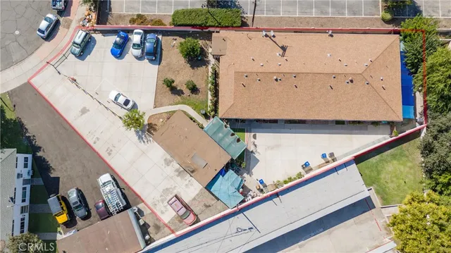 an aerial view of a house with a swimming pool