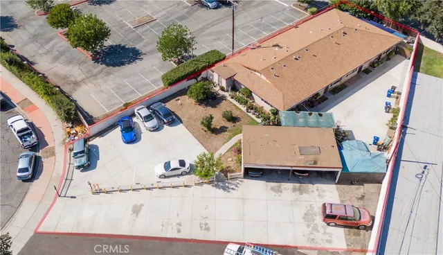 an aerial view of a house with a yard