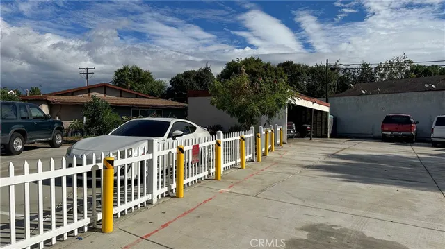 a front view of a house with parking space