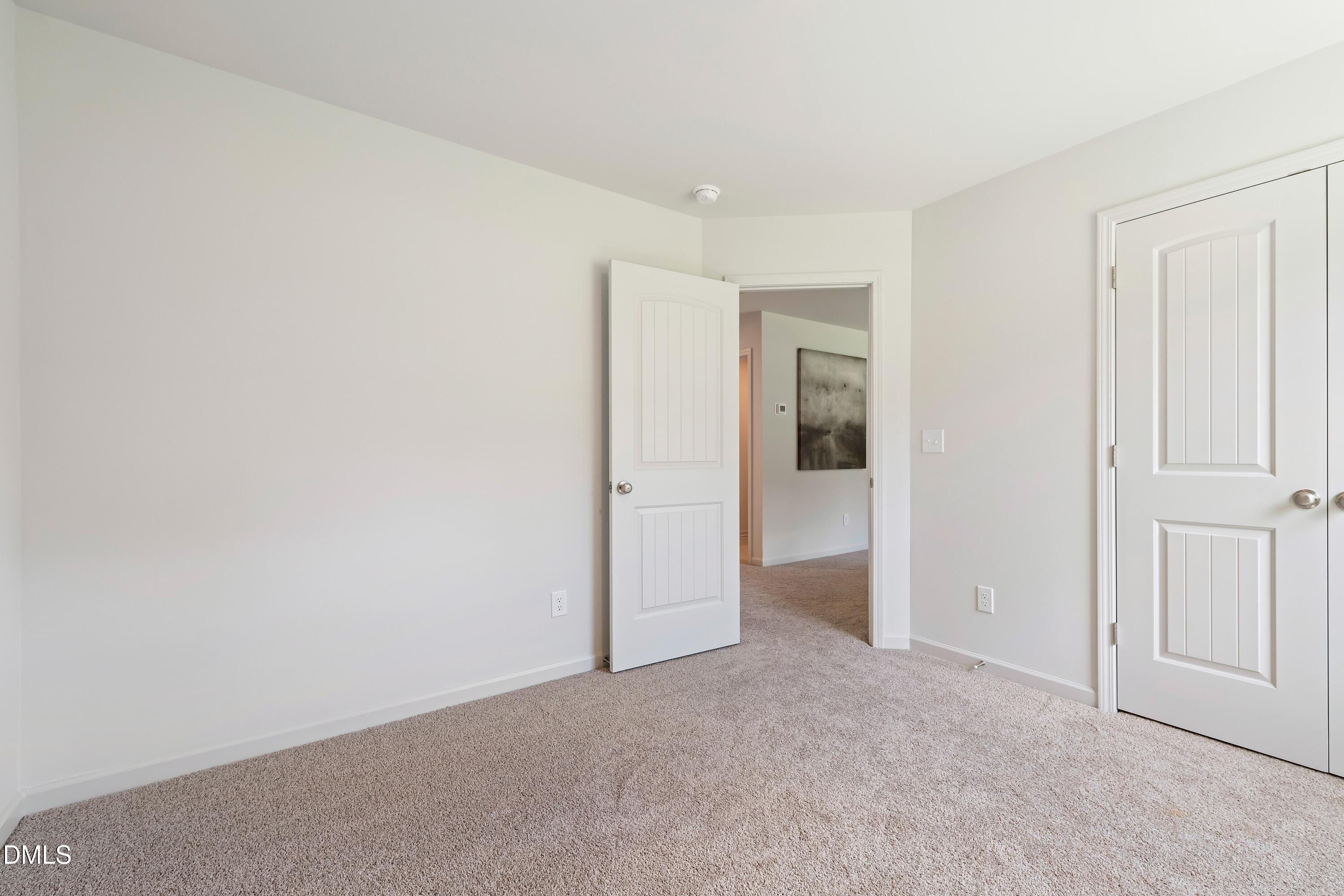 124 Starlet Ridge Way Clayton, NC 27520 - Photo 23 of 36 an empty room with closet area