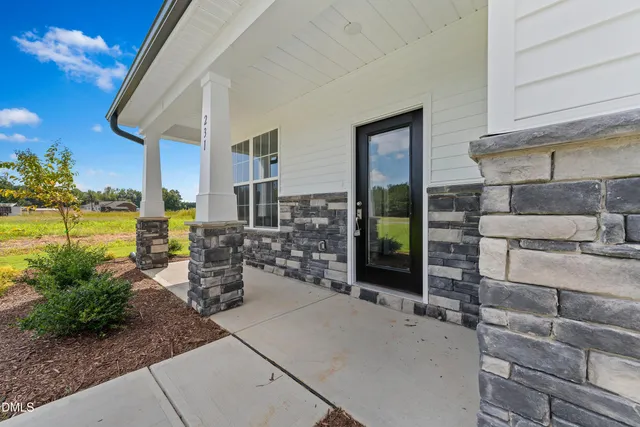 a view of a chairs and table in the patio