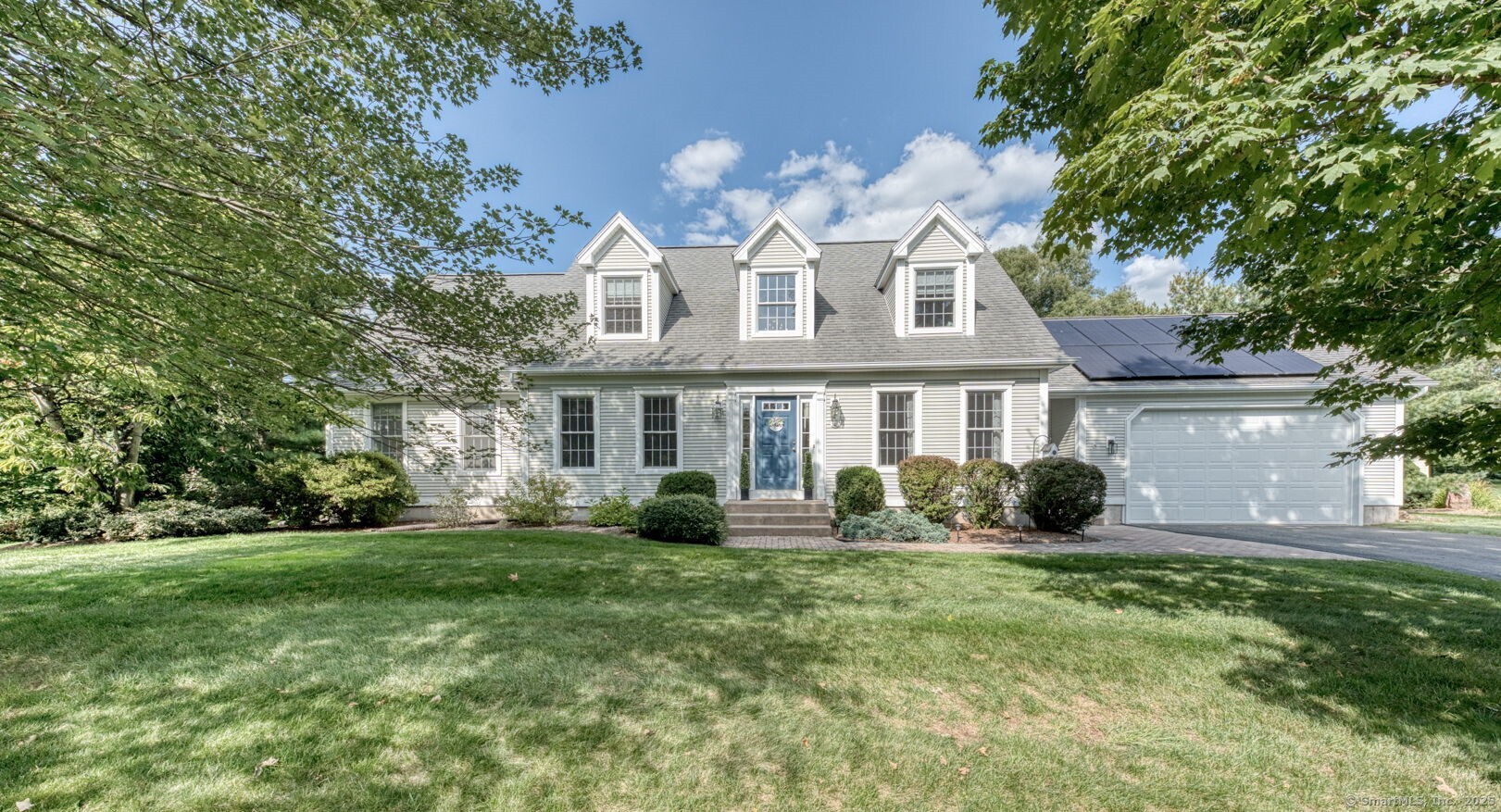 a front view of a house with a yard