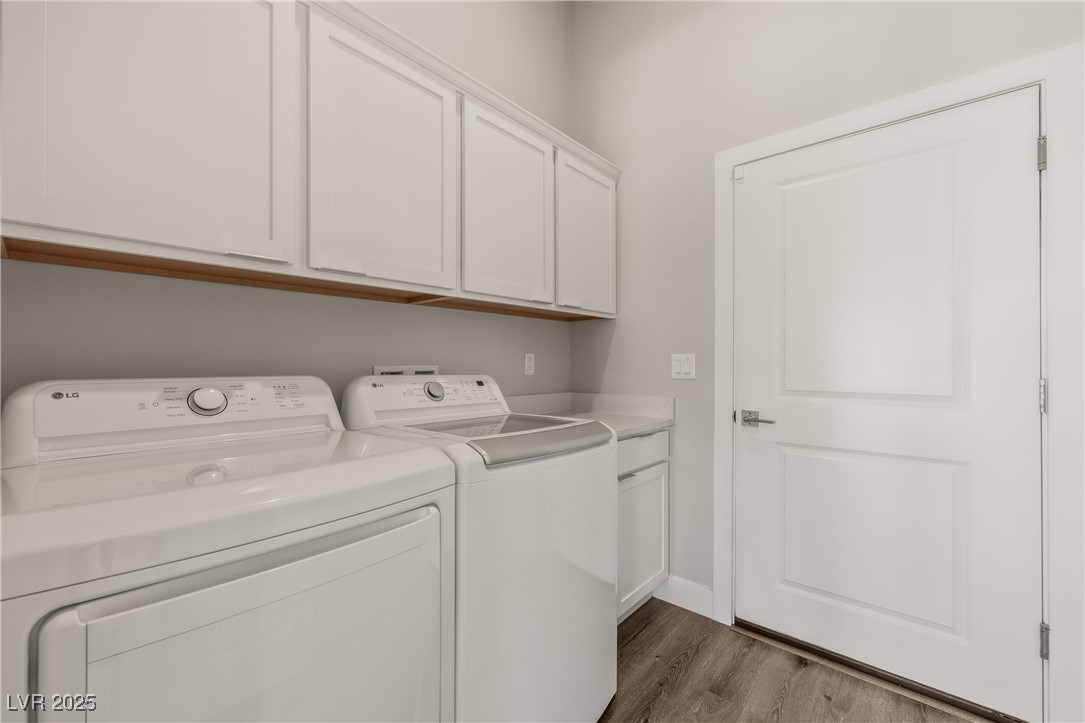 1357 Manassas Ridge Mesquite, NV 89027 - Photo 41 of 72 Washroom featuring separate washer and dryer, wood finished floors, cabinet space, and baseboards