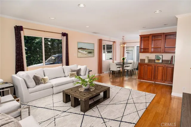 a dining room with furniture and wooden floor
