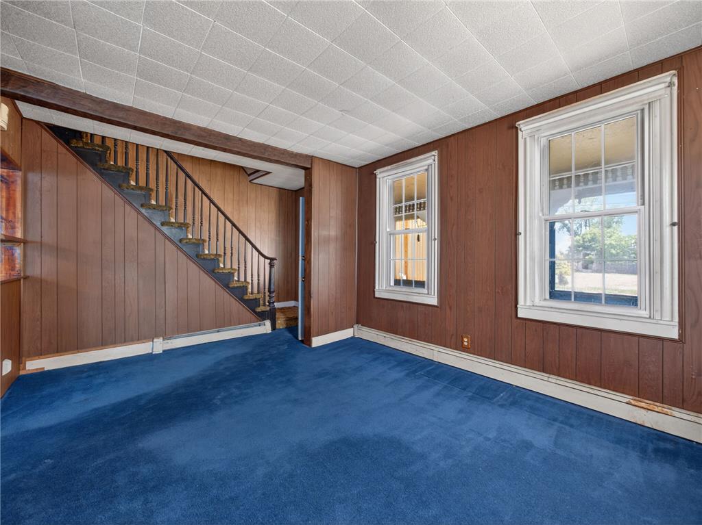 15845 Kutztown Road Mertztown, PA 19539 - Photo 4 of 24 A versatile living space with a classic staircase and ample natural light.