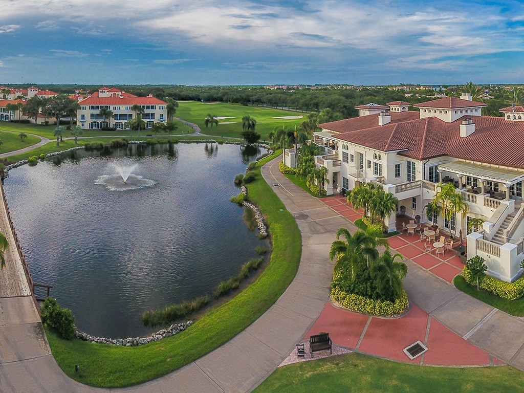 2139 Falls Circle Vero Beach, FL 32967 - Photo 17 of 17 front view of a house with a garden and lake view