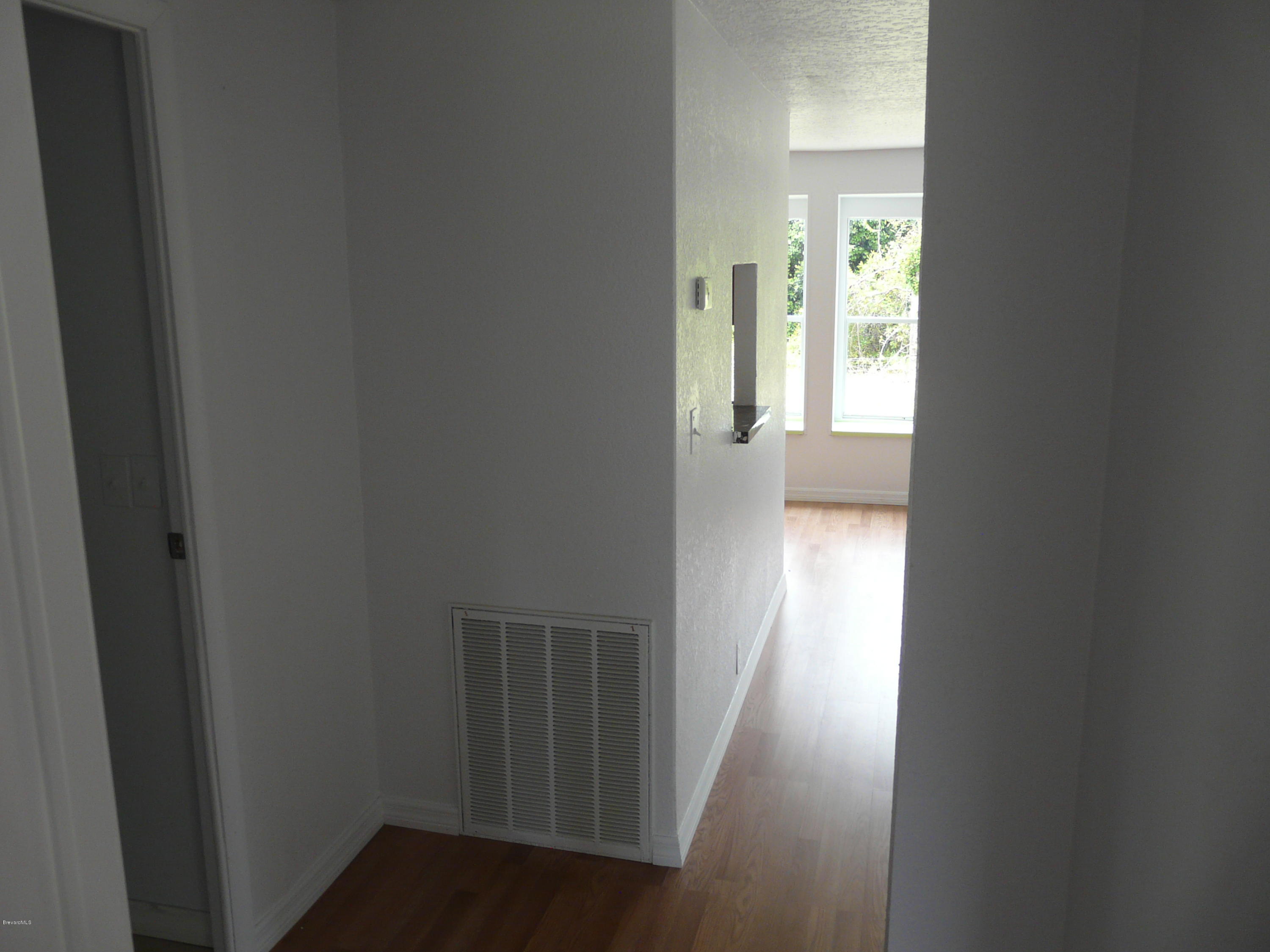 4271 Aurantia Road Mims, FL 32754 - Photo 22 of 28 Bedroom hall to family room