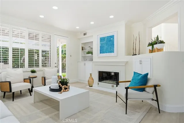 a white bath tub sitting in a bathroom next to a window