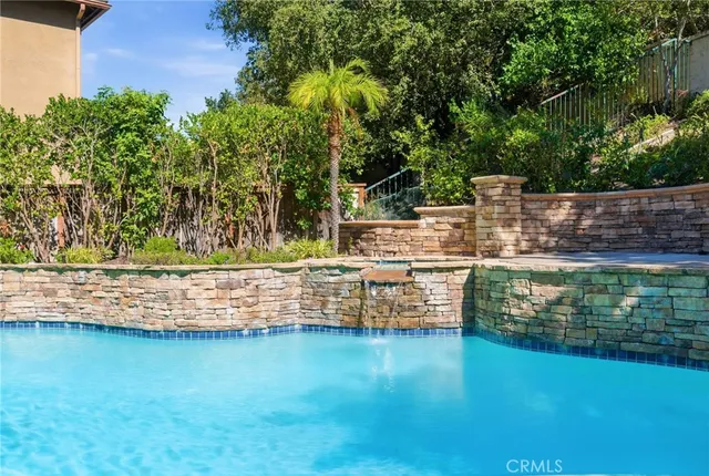 a view of a patio with table and chairs and potted plants