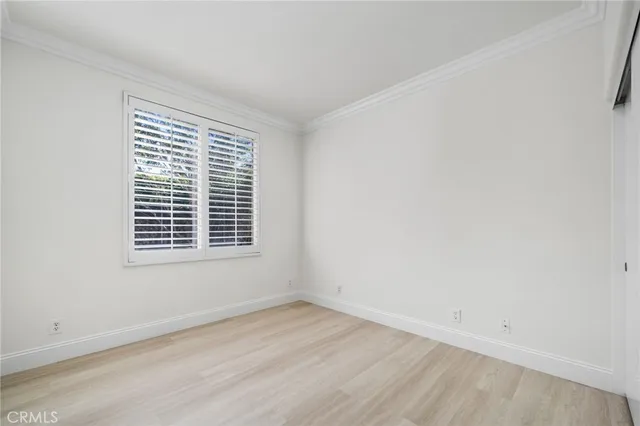 a spacious bathroom with a double vanity sink and mirror