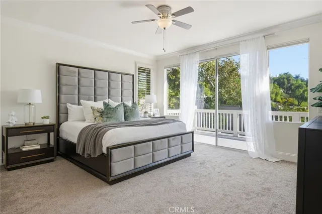 an empty room with a ceiling fan and wooden floor