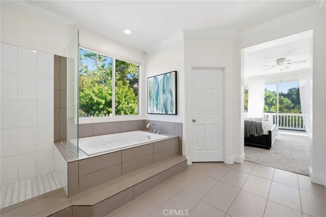 a view of a lush green hillside and houses