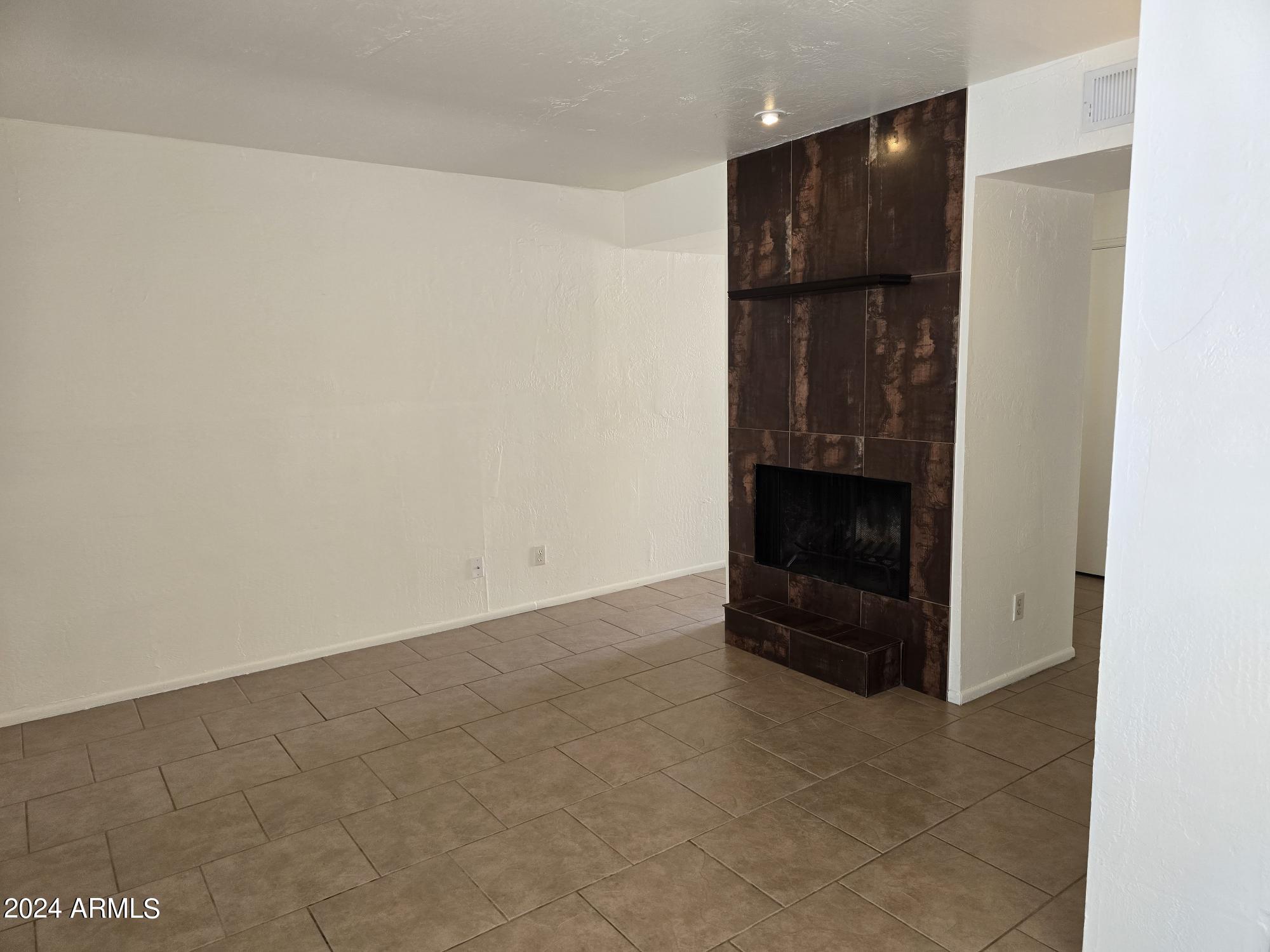 4747 North 14th Street, Unit J Phoenix, AZ 85014 - Photo 4 of 25 living room w/gas fireplace
