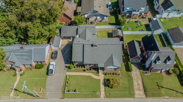 an aerial view of a house with lots of trees