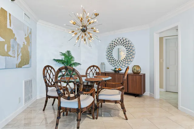 a spacious bedroom with a bed and glass window