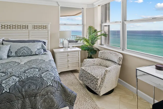 a bedroom with a bed and a couch