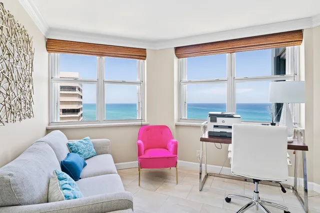 a spacious bedroom with a bed and a flat screen tv