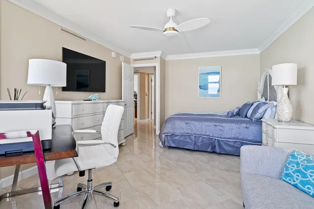 a bathroom with a sink mirror vanity and toilet