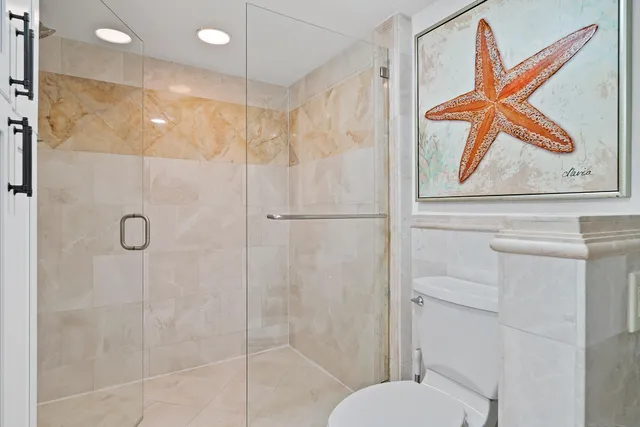 a bathroom with a shower and a sink