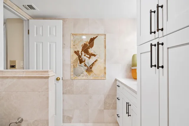 a view of a dining room with furniture and a window