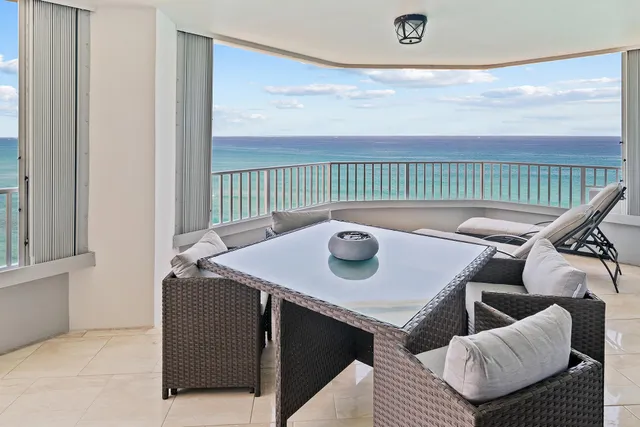 a view of a balcony with furniture