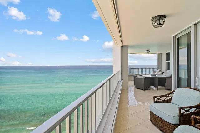 a balcony with wooden floor
