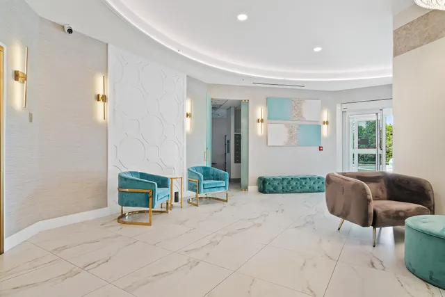 a dining room with furniture and view of kitchen