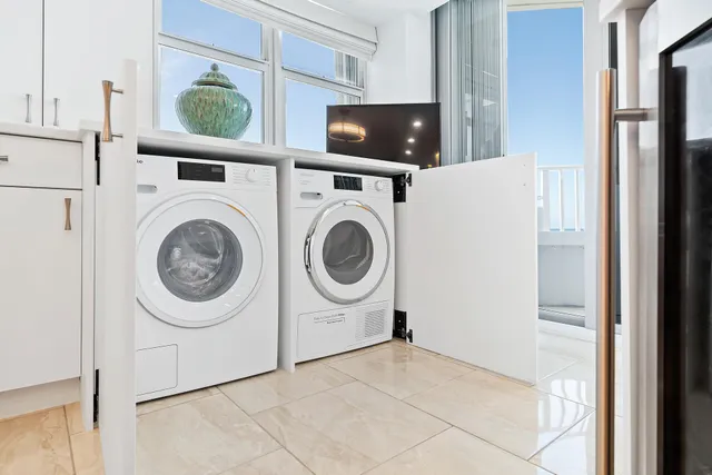 a view of a livingroom with furniture and a flat screen tv