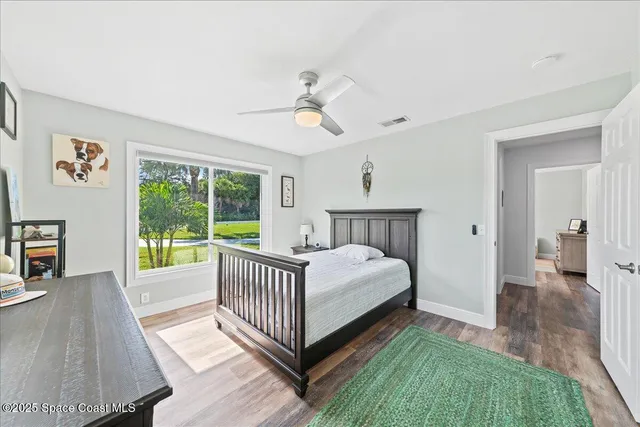 a bed room with a bed and a chandelier