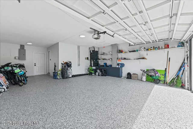 a view of livingroom with furniture and a garage