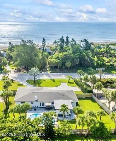 a view of a swimming pool and an outdoor space